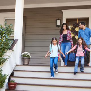 Family conveys excitement to leave home for vacation showing the importance of securing the home.